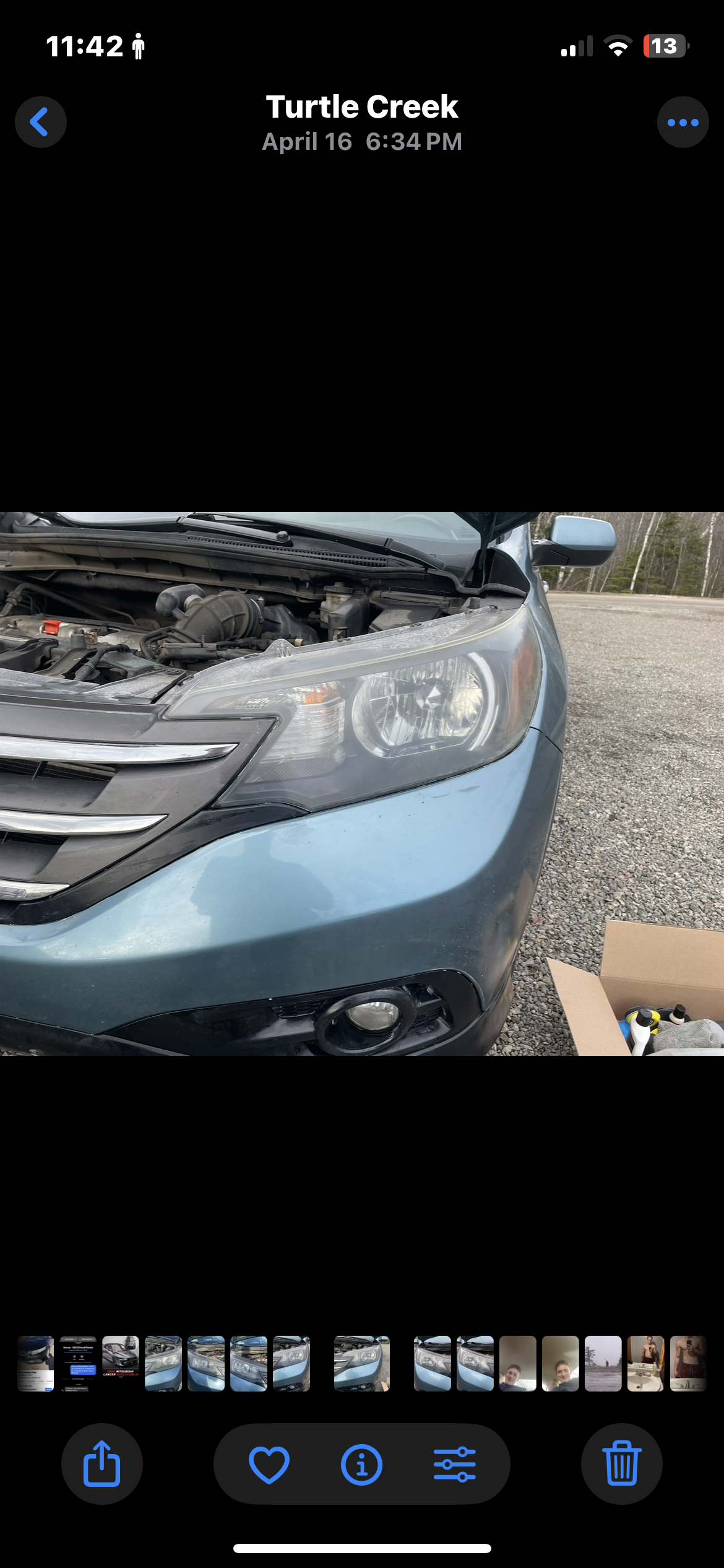 Clear headlight after restoration on teal Honda CR-V